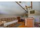 Open living space with a partial kitchen, a bed, and comfortable seating at 3011 Broughton Rd, Newborn, GA 30056