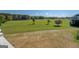 Expansive property with trees under a blue sky and scattered trees in the background at 3011 Broughton Rd, Newborn, GA 30056