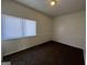 Well-lit bedroom with plush carpet, a window, and neutral walls at 7560 Taylor Rd # 5, Riverdale, GA 30274