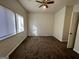 Comfortable bedroom with plush carpet, a ceiling fan, and plenty of natural light at 7560 Taylor Rd # 5, Riverdale, GA 30274