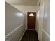 Inviting entryway featuring a wood door, a white closet door and luxury vinyl plank flooring at 7560 Taylor Rd # 5, Riverdale, GA 30274