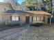Charming brick home featuring a well-kept lawn, complementing the home's cozy curb appeal at 7560 Taylor Rd # 5, Riverdale, GA 30274
