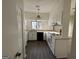 Well-lit kitchen featuring black appliances, updated countertops, and an open concept design at 7560 Taylor Rd # 5, Riverdale, GA 30274