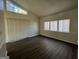 Bright living room with high ceilings, luxury vinyl plank flooring, and large windows at 7560 Taylor Rd # 5, Riverdale, GA 30274