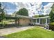 Brick home with a screened-in porch, patio and gated carport at 2572 Creston Way, Morrow, GA 30260