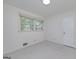 Neutral bedroom with carpet floors and a pair of windows for natural light at 2572 Creston Way, Morrow, GA 30260