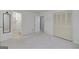 Bedroom with a view into the bathroom and carpeted flooring with a closet at 2572 Creston Way, Morrow, GA 30260