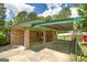 The carport features a brick column support and a translucent cover at 2572 Creston Way, Morrow, GA 30260