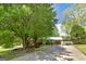 Charming single-story home with a large tree and driveway at 2572 Creston Way, Morrow, GA 30260