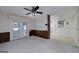 Living area with glass patio doors that let in ample light and connect to an enclosed porch at 2572 Creston Way, Morrow, GA 30260