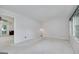 Spacious, well-lit living room with neutral carpet, ceiling fan, and a view to another room at 2572 Creston Way, Morrow, GA 30260