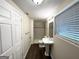 Secondary bathroom features a standing sink, tile shower, and modern finishes at 6026 S Bear Dr, Douglasville, GA 30135