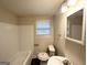 Well-lit bathroom with a shower-tub combo and updated fixtures at 6026 S Bear Dr, Douglasville, GA 30135