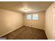 Comfortable bedroom with carpet flooring and natural lighting from a window at 6026 S Bear Dr, Douglasville, GA 30135