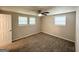 Bright bedroom featuring carpet floors, natural lighting from the window, and neutral walls at 6026 S Bear Dr, Douglasville, GA 30135