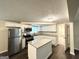 Beautiful kitchen with stainless steel appliances, granite countertops, and a central island at 6026 S Bear Dr, Douglasville, GA 30135
