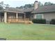 Green backyard with a nice wooden deck that is good for outdoor living at 6279 Giles Rd, Lithonia, GA 30058