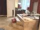Elegant bathroom featuring a large soaking tub with tiled stairs and neutral tile flooring at 6279 Giles Rd, Lithonia, GA 30058