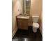 Bathroom with a tiled floor, single sink vanity with a granite countertop, and toilet at 6279 Giles Rd, Lithonia, GA 30058
