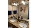 Bathroom featuring a double vanity with granite countertop, a large mirror, and tiled walls at 6279 Giles Rd, Lithonia, GA 30058