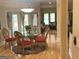 Charming dining room with glass table, elegant chairs, and a view of the backyard at 6279 Giles Rd, Lithonia, GA 30058