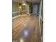 Spacious empty room with hardwood floors, neutral walls, and a ceiling fan at 6279 Giles Rd, Lithonia, GA 30058
