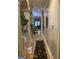 Inviting hallway featuring hardwood floors and decorative columns at 6279 Giles Rd, Lithonia, GA 30058