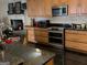 Modern kitchen with stainless steel appliances, granite countertops, and ample cabinetry at 6279 Giles Rd, Lithonia, GA 30058