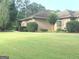Beautiful landscaping with mature shrubs and a well-maintained lawn at 6279 Giles Rd, Lithonia, GA 30058