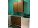 Laundry room featuring modern washer and dryer, wood cabinets with granite counters and green walls at 6279 Giles Rd, Lithonia, GA 30058