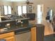 Open-concept living room featuring hardwood floors, ceiling fan, and modern fixtures at 6279 Giles Rd, Lithonia, GA 30058