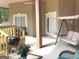 Inviting patio with a porch swing and a grill perfect for enjoying outdoor leisure at 6279 Giles Rd, Lithonia, GA 30058