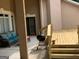 Covered patio featuring a grill, seating area, and access to a wooden deck at 6279 Giles Rd, Lithonia, GA 30058