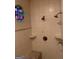 Shower featuring a bench seat, tiled walls, and a stained glass window at 6279 Giles Rd, Lithonia, GA 30058