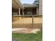 The beautiful wooden deck is perfect for outdoor entertaining and grilling with friends and Gathering at 6279 Giles Rd, Lithonia, GA 30058