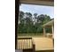 Enjoy the view of the wooded backyard from this home's spacious wooden deck at 6279 Giles Rd, Lithonia, GA 30058