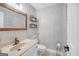 Charming half bathroom featuring modern fixtures, stylish vanity, and shiplap accent wall at 205 Olde Oak Dr, Jonesboro, GA 30238