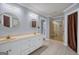 Bathroom featuring double vanities and a glass-enclosed shower at 205 Olde Oak Dr, Jonesboro, GA 30238