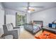 A bright bedroom features a large window and a bed with dinosaur themed bedding at 205 Olde Oak Dr, Jonesboro, GA 30238