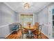 Cozy dining area features hardwood floors, decorative lighting, and an inviting atmosphere at 205 Olde Oak Dr, Jonesboro, GA 30238