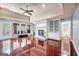 The living room has hardwood floors, built-in shelves, and white painted brick at 205 Olde Oak Dr, Jonesboro, GA 30238