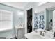 A full bath features a shower/tub combination, a double sink vanity, and a walk-in closet at 321 Harris Ave, Locust Grove, GA 30248