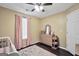 Charming bedroom with a crib, dresser and soft pink accents at 321 Harris Ave, Locust Grove, GA 30248