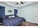 Bedroom featuring a large bed, dark blue curtains, and light blue walls at 321 Harris Ave, Locust Grove, GA 30248