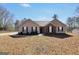 Charming single-story home with a well-maintained front yard and a mix of vinyl siding and brick facade at 321 Harris Ave, Locust Grove, GA 30248