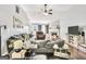 Spacious living room featuring hardwood floors, a cozy fireplace, and abundant natural light at 321 Harris Ave, Locust Grove, GA 30248