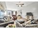 Comfortable living room showing warm fireplace, TV, and plush sofas for relaxation and entertainment at 321 Harris Ave, Locust Grove, GA 30248