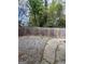 Fenced backyard featuring a gravel area and a concrete patio, perfect for outdoor entertaining or relaxation at 7560 Taylor Rd # 1, Riverdale, GA 30274