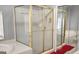 Bright bathroom featuring a glass-enclosed shower and a jacuzzi tub at 1622 Brentwood Se Xing, Conyers, GA 30013
