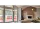 Open kitchen area with view to bright living space, fireplace, and access to the deck at 1622 Brentwood Se Xing, Conyers, GA 30013
